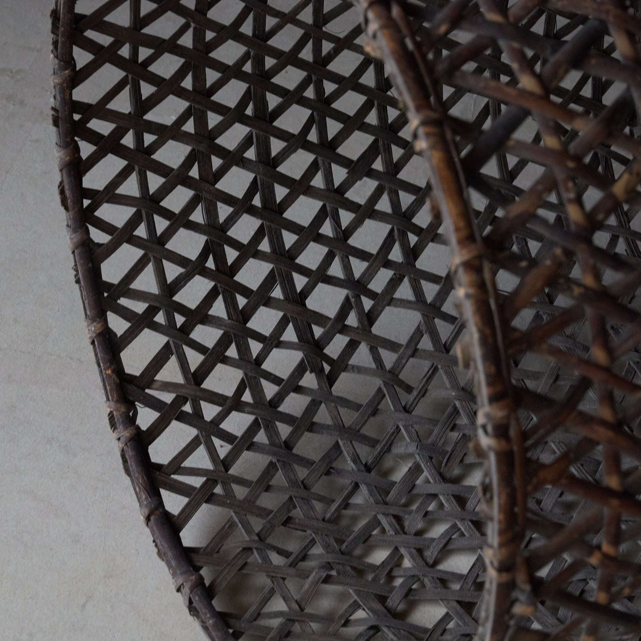 A well-used antique woven basket object from the Taisho period/1912-1926CE