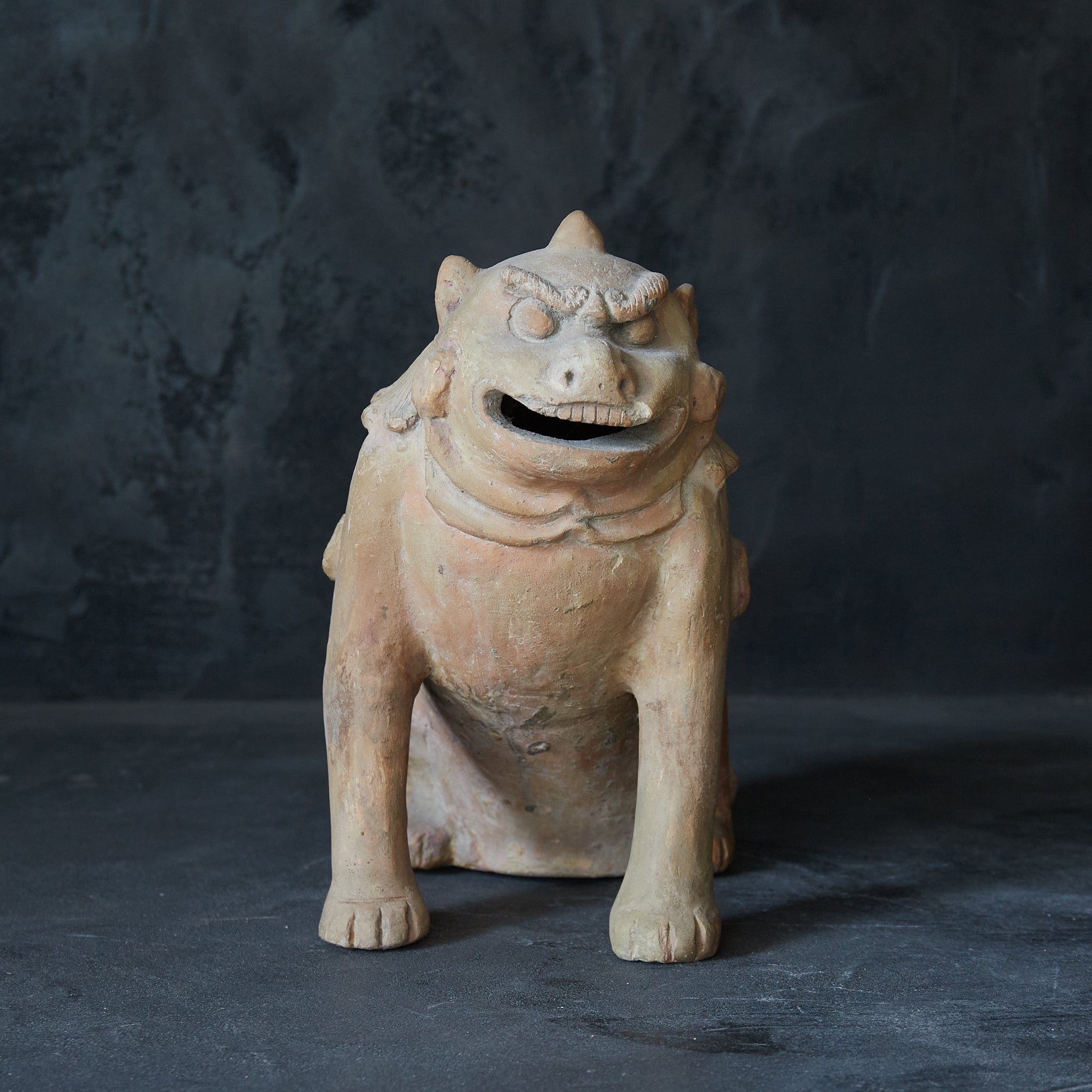 Earthenware lion statue