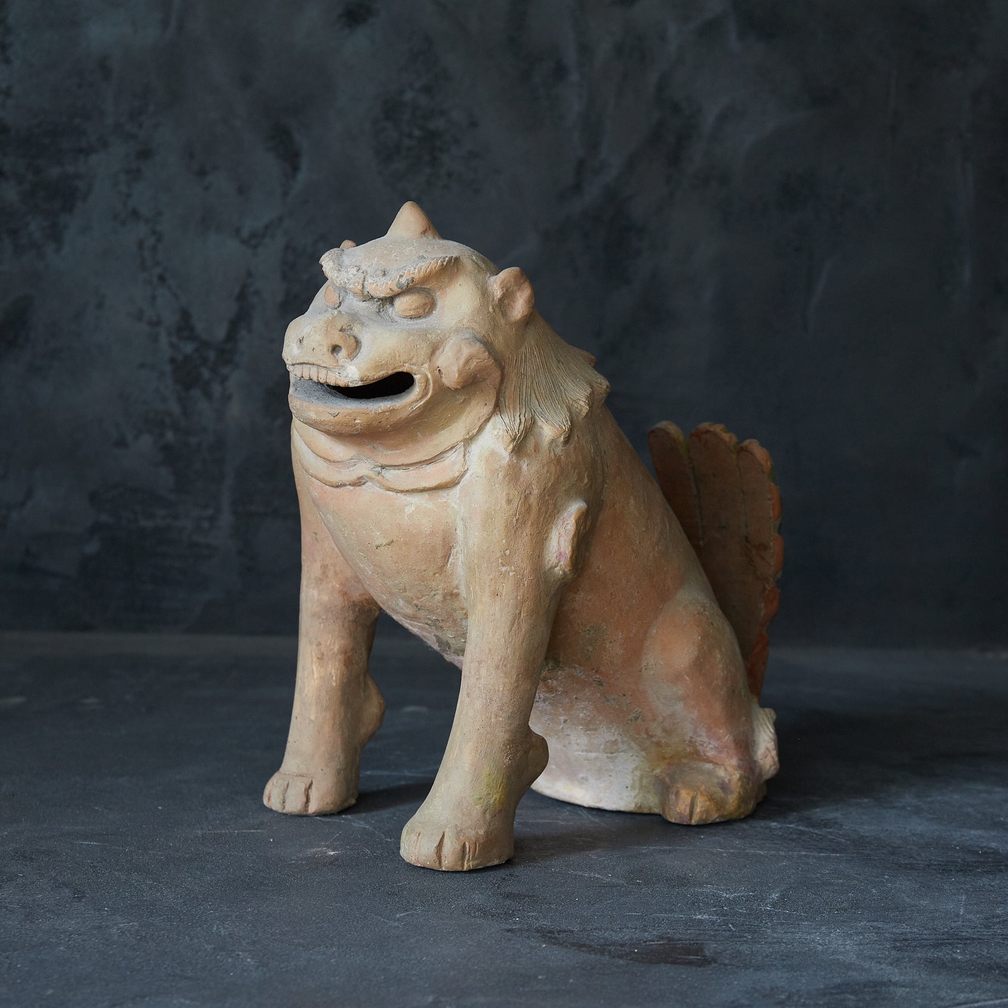 Earthenware lion statue