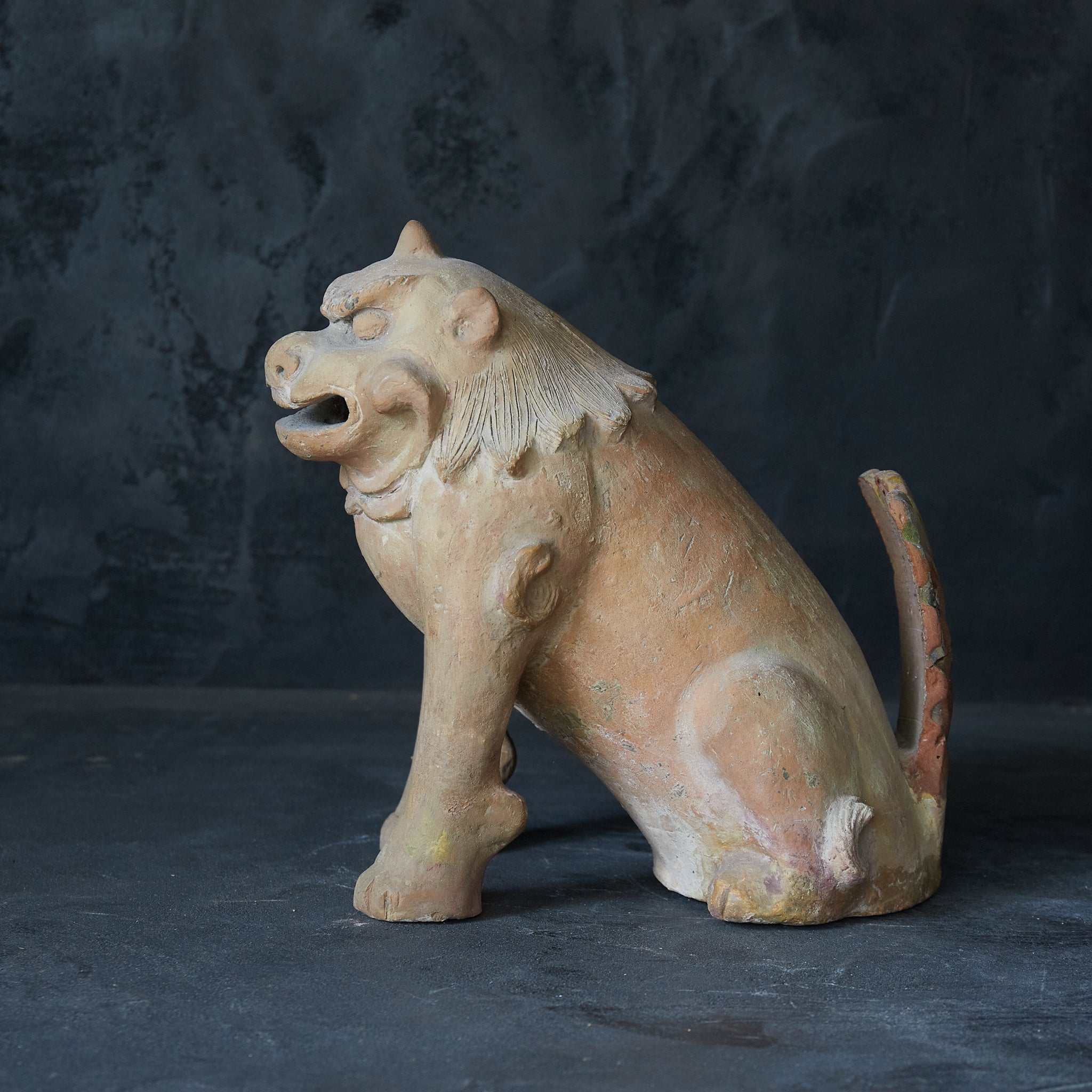 Earthenware lion statue