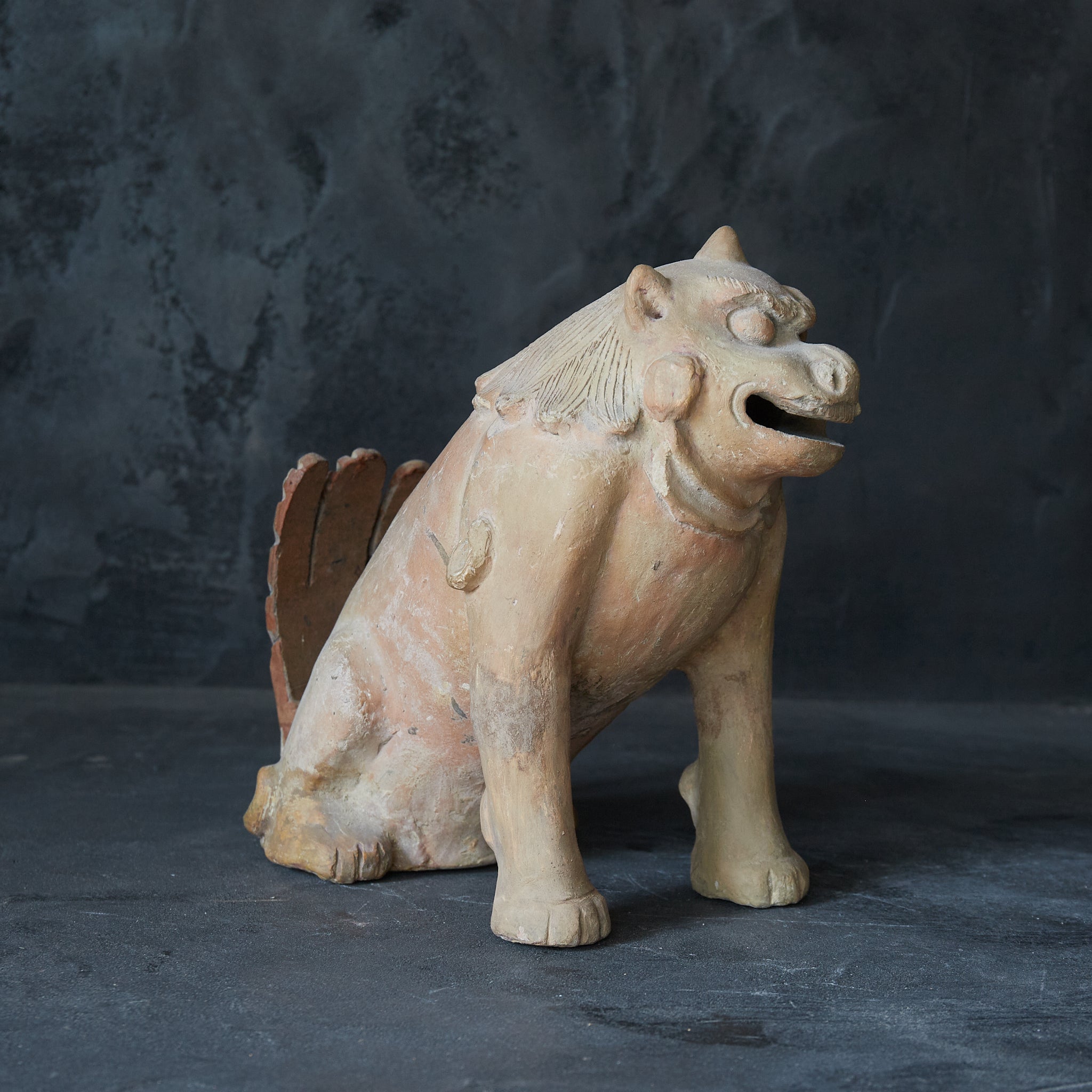 Earthenware lion statue