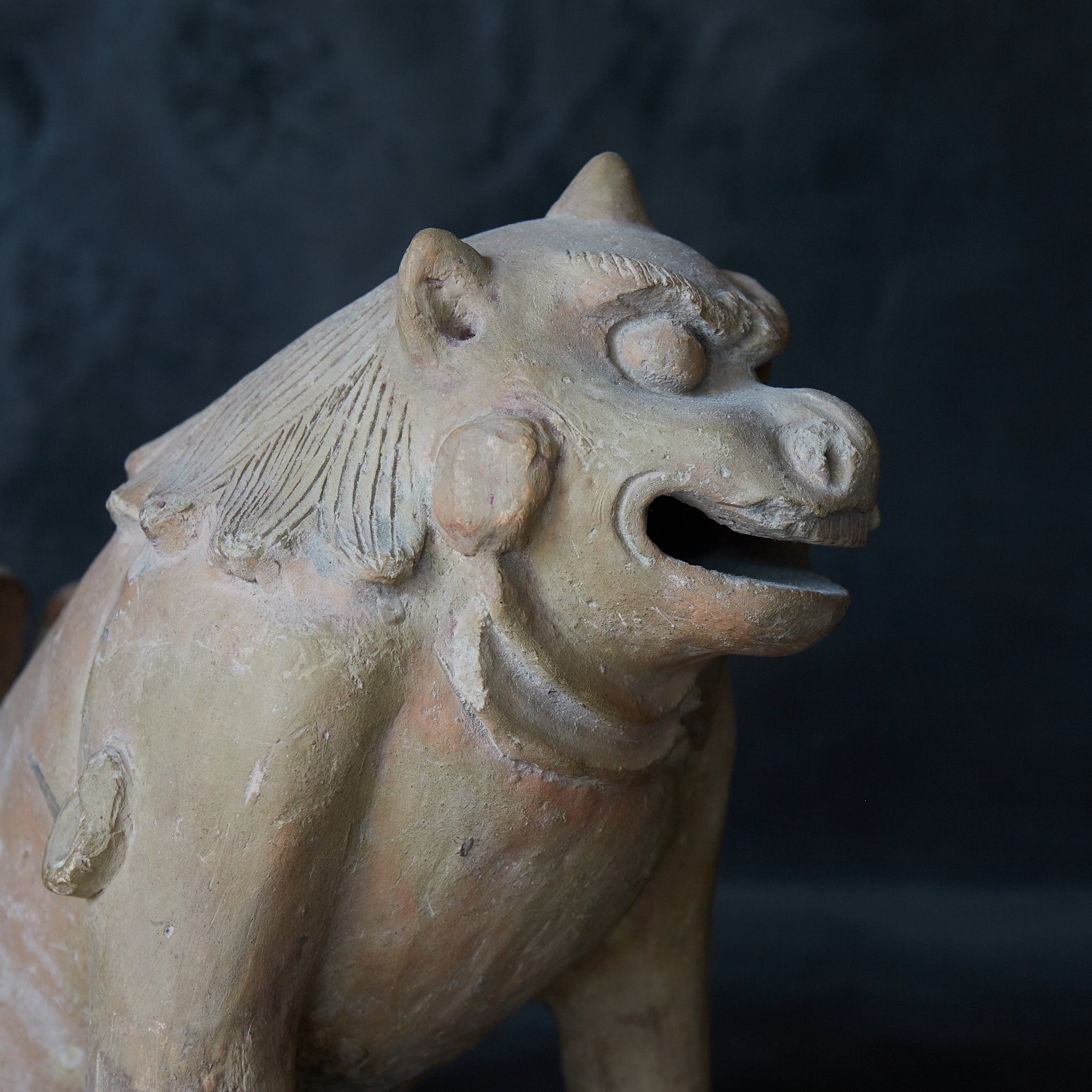 Earthenware lion statue