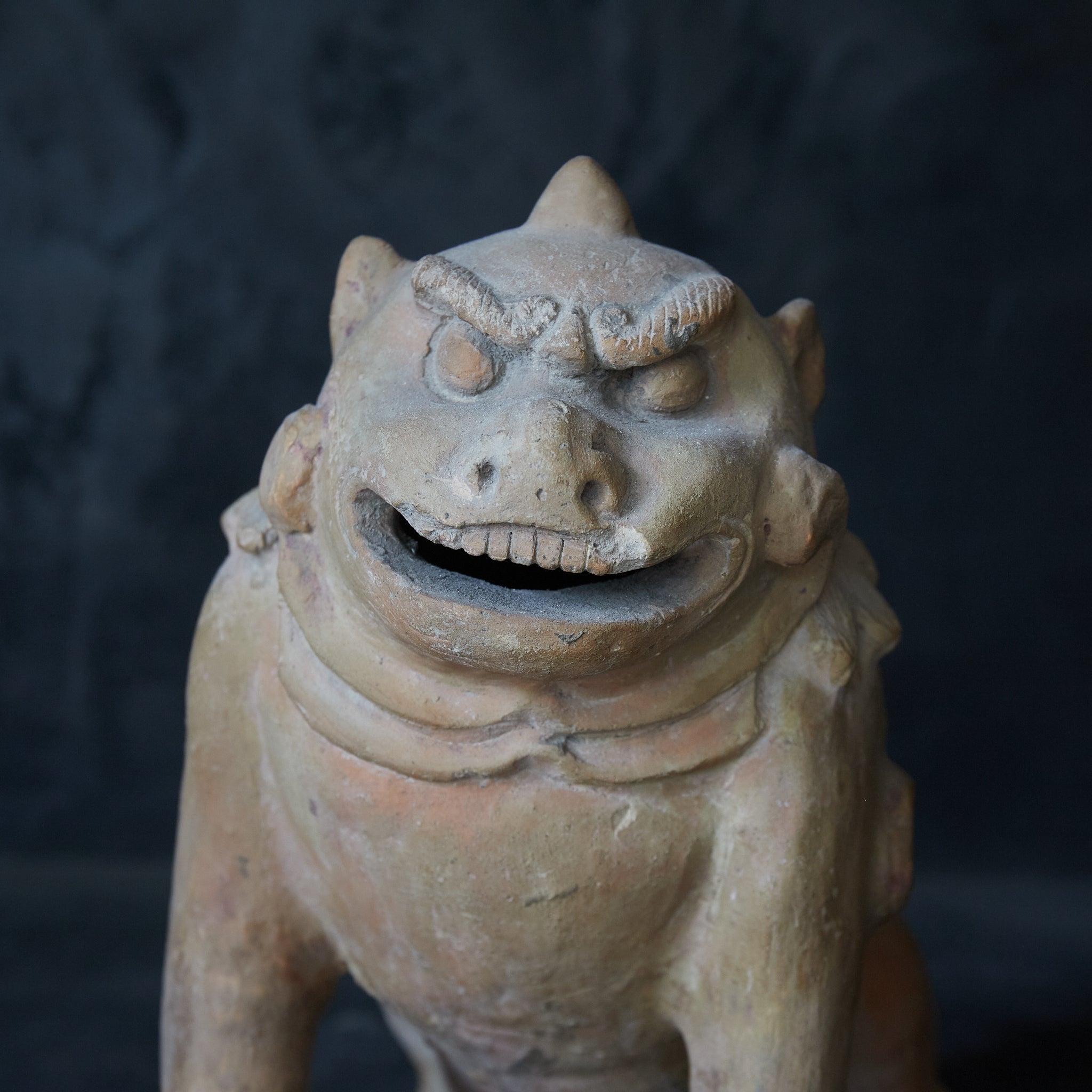 Earthenware lion statue