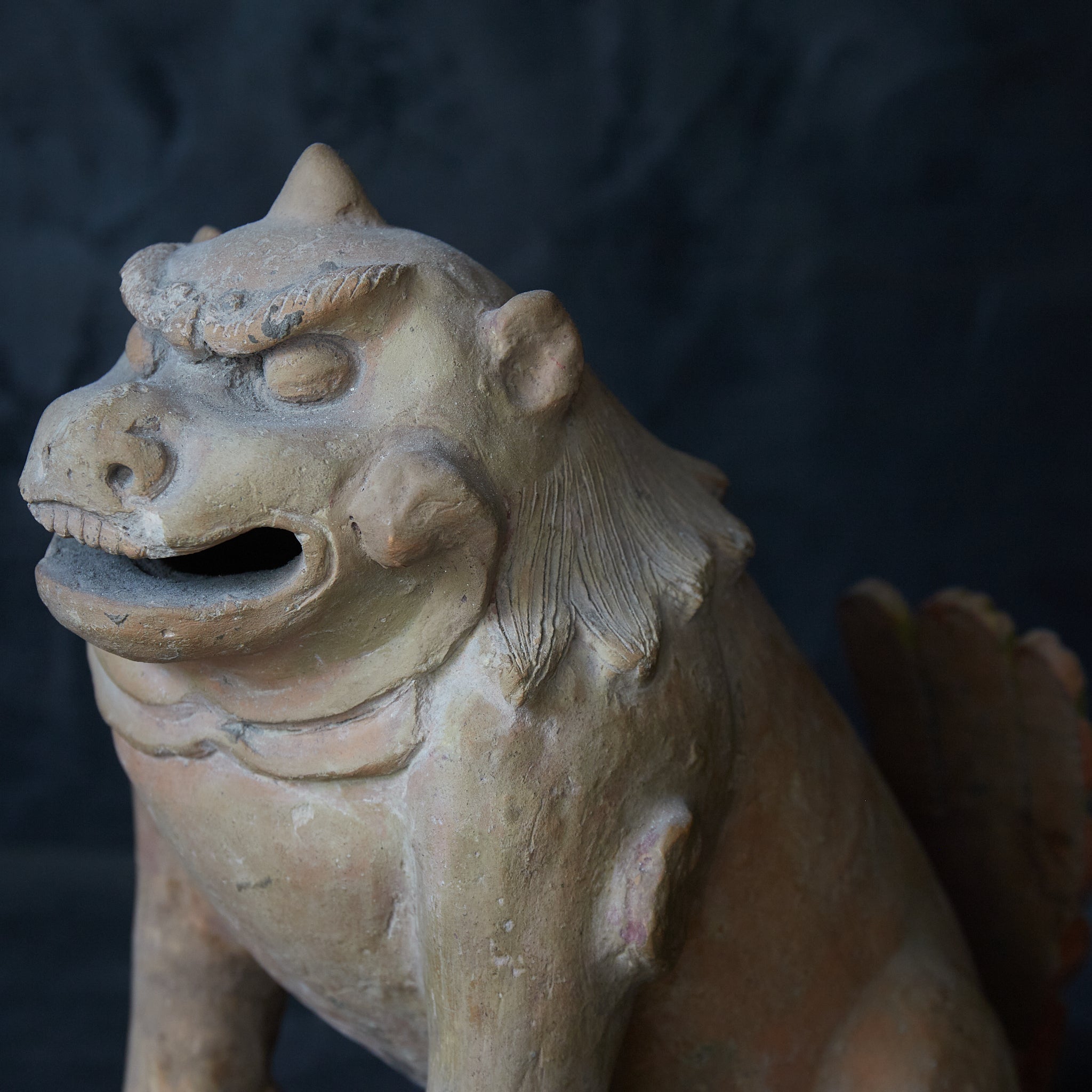 Earthenware lion statue