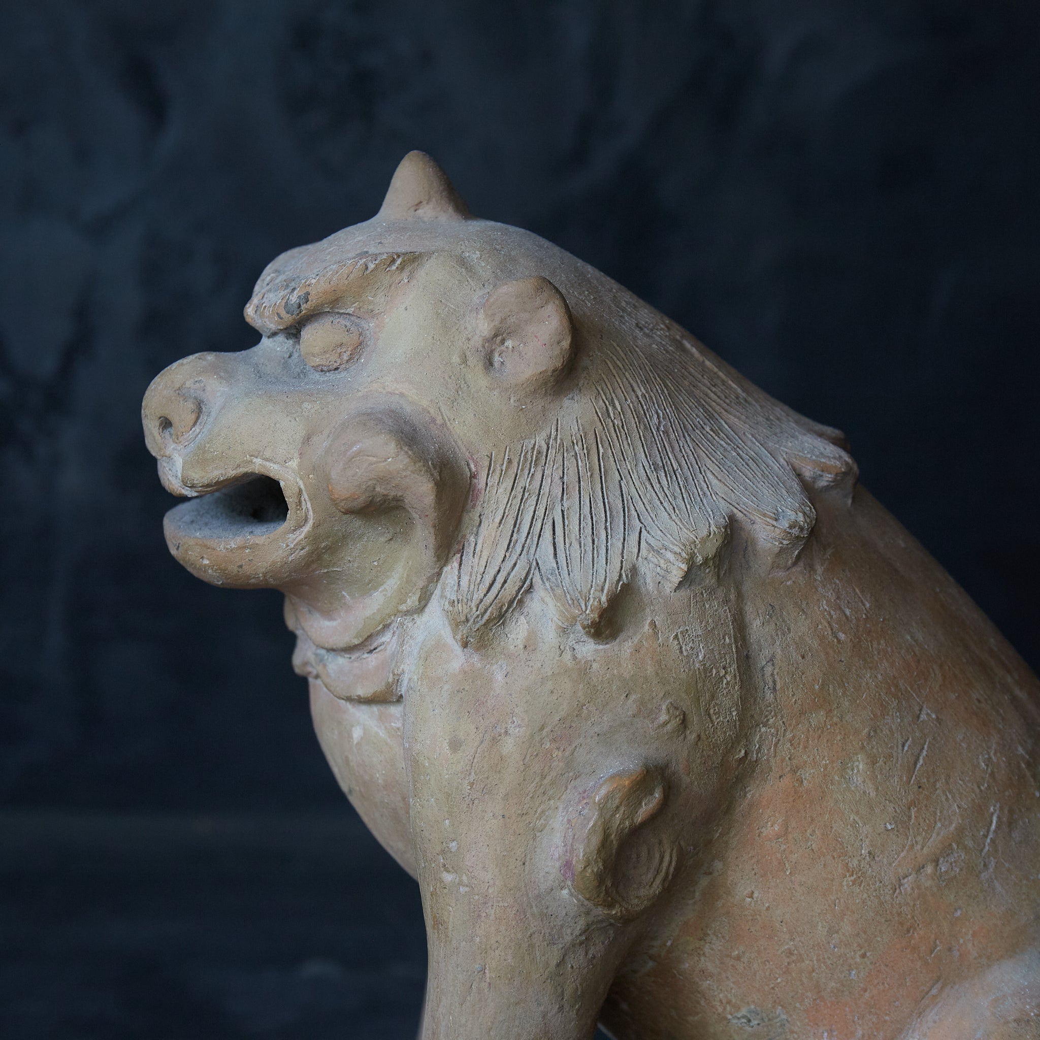 Earthenware lion statue