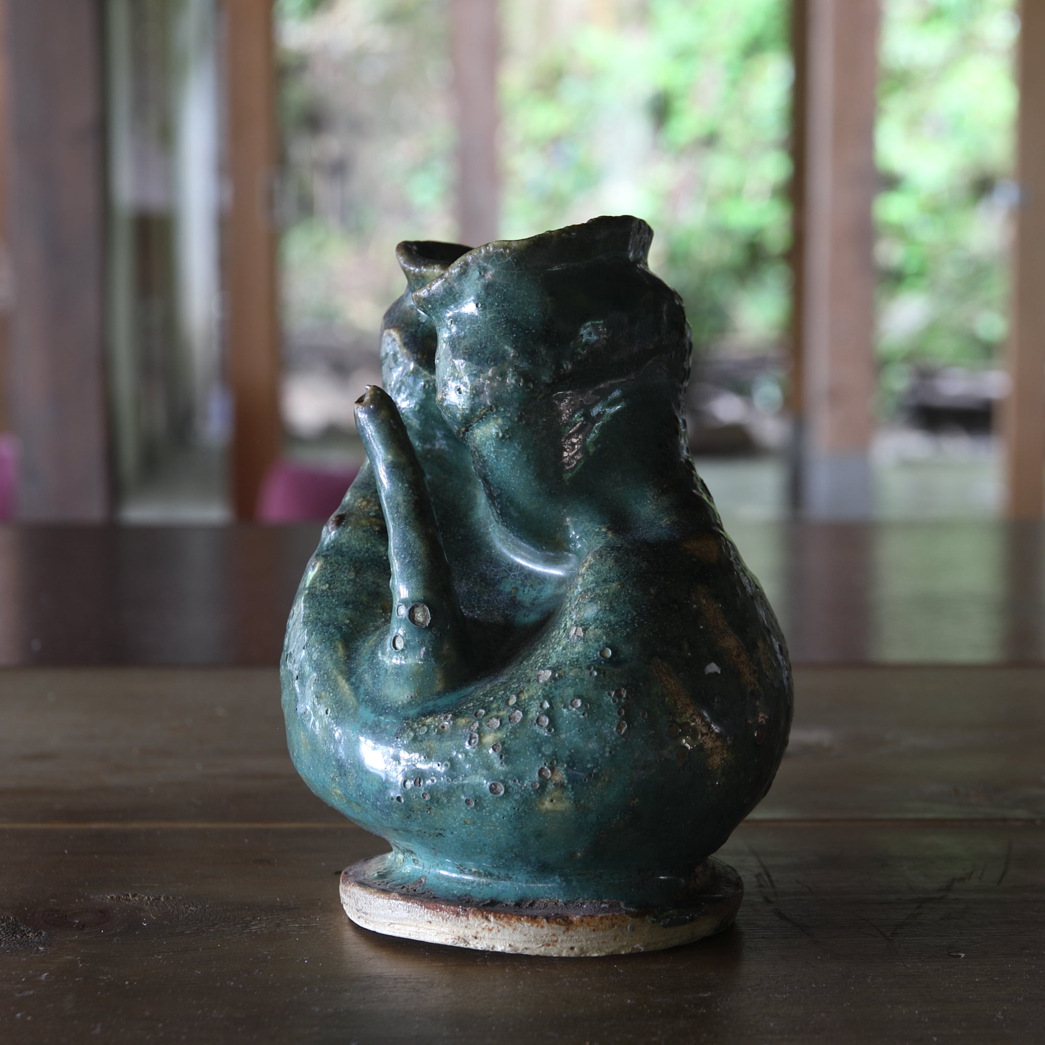 Green glaze water jug, details unknown