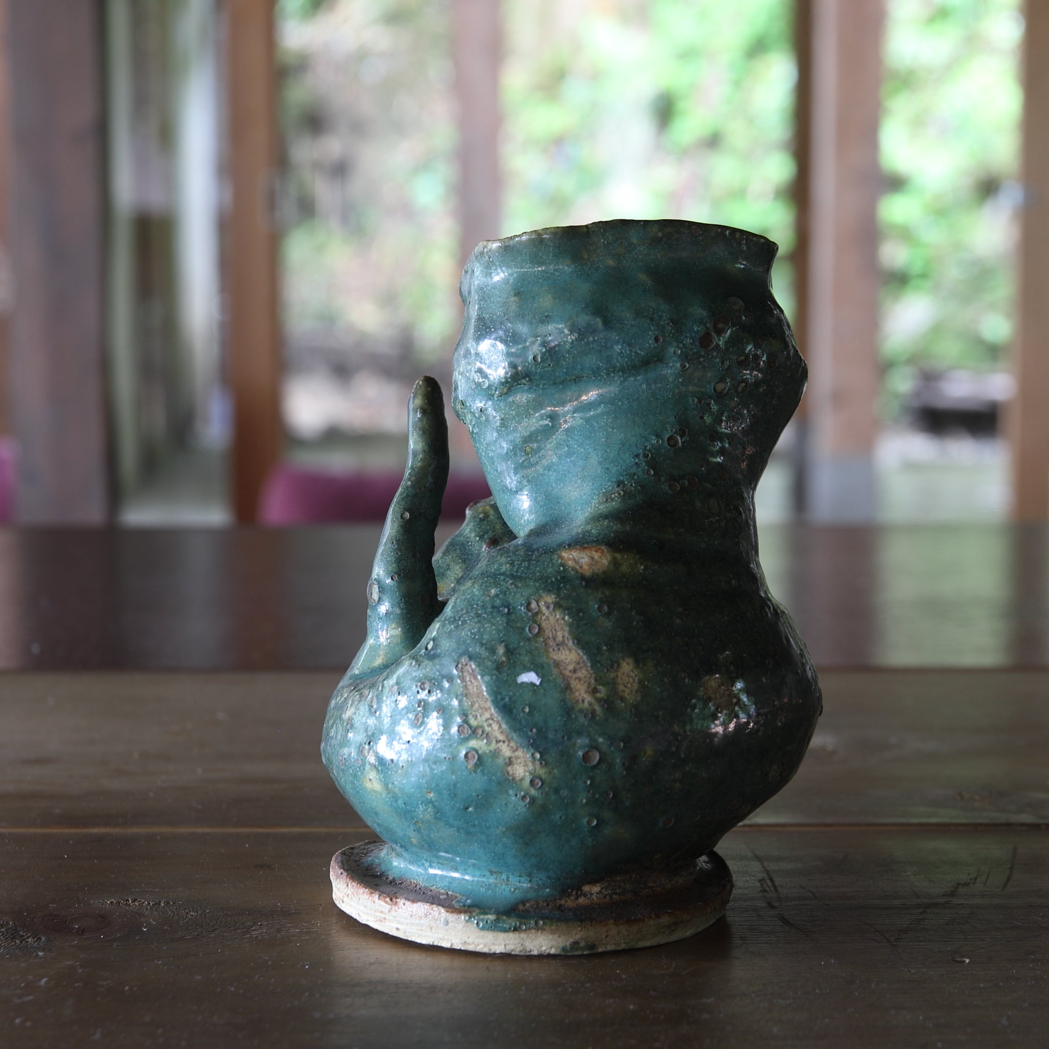 Green glaze water jug, details unknown