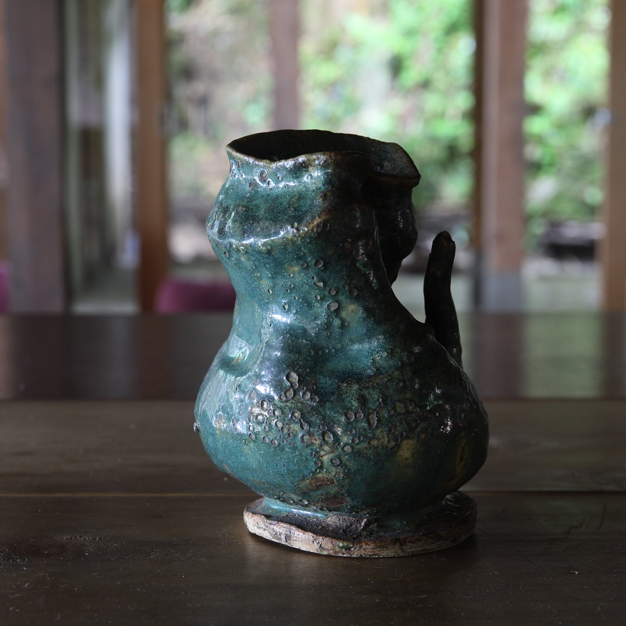 Green glaze water jug, details unknown