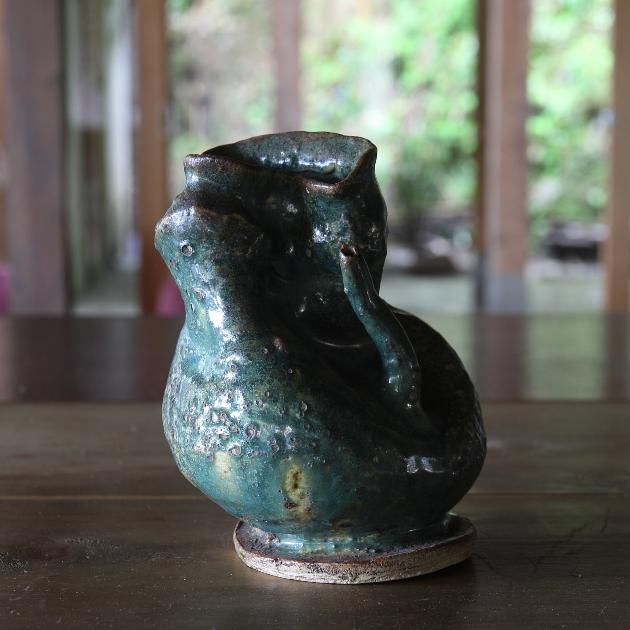 Green glaze water jug, details unknown