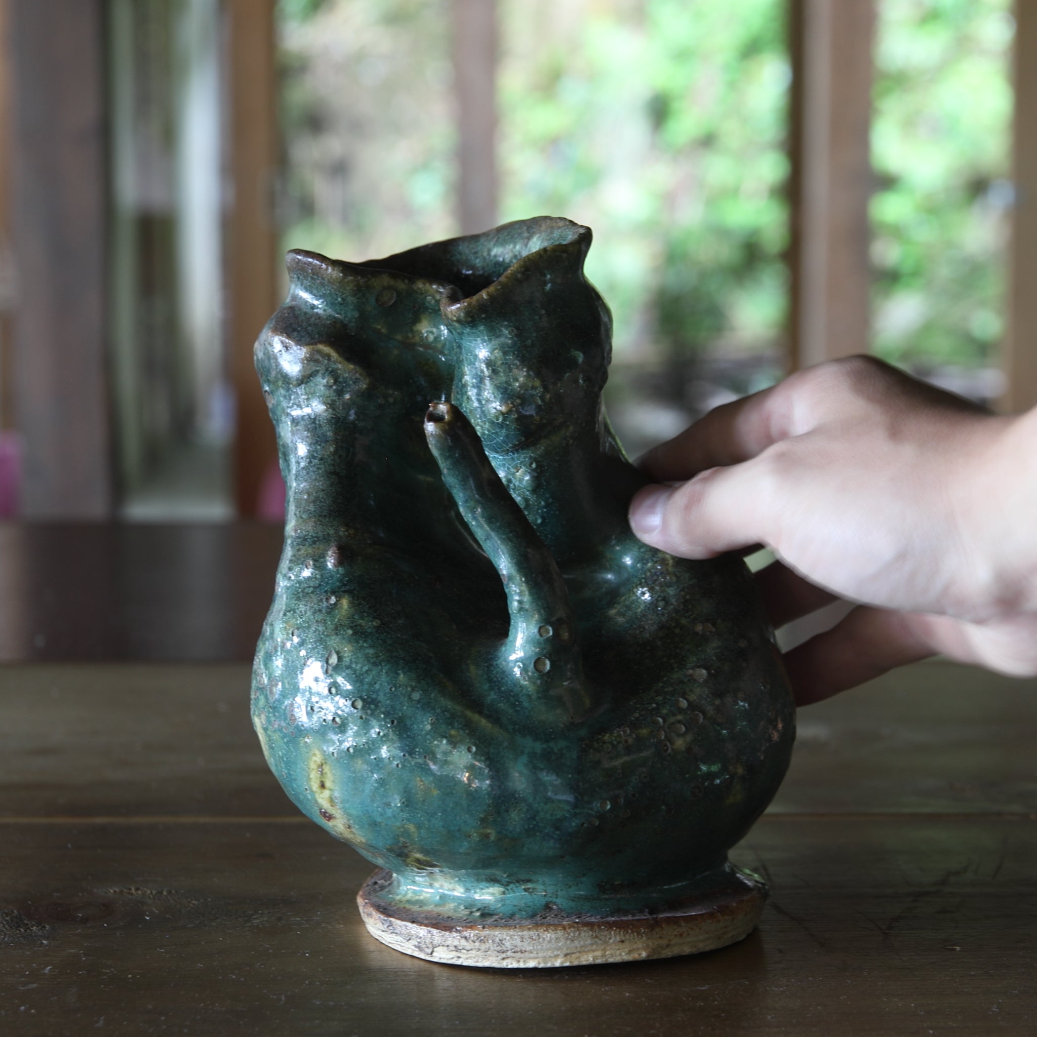 Green glaze water jug, details unknown