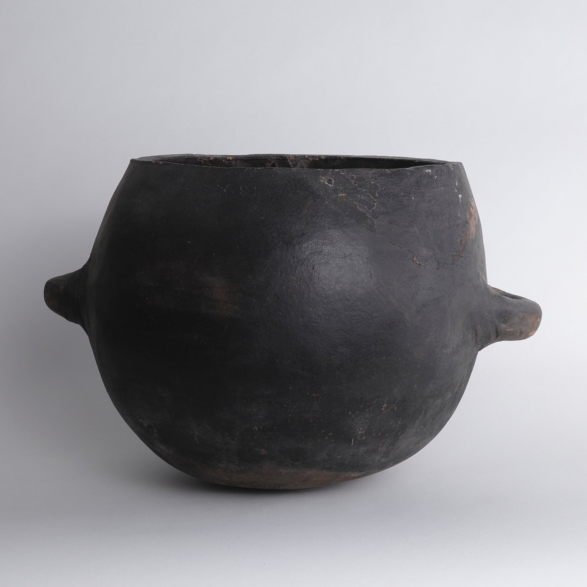 Black earthenware with large handle