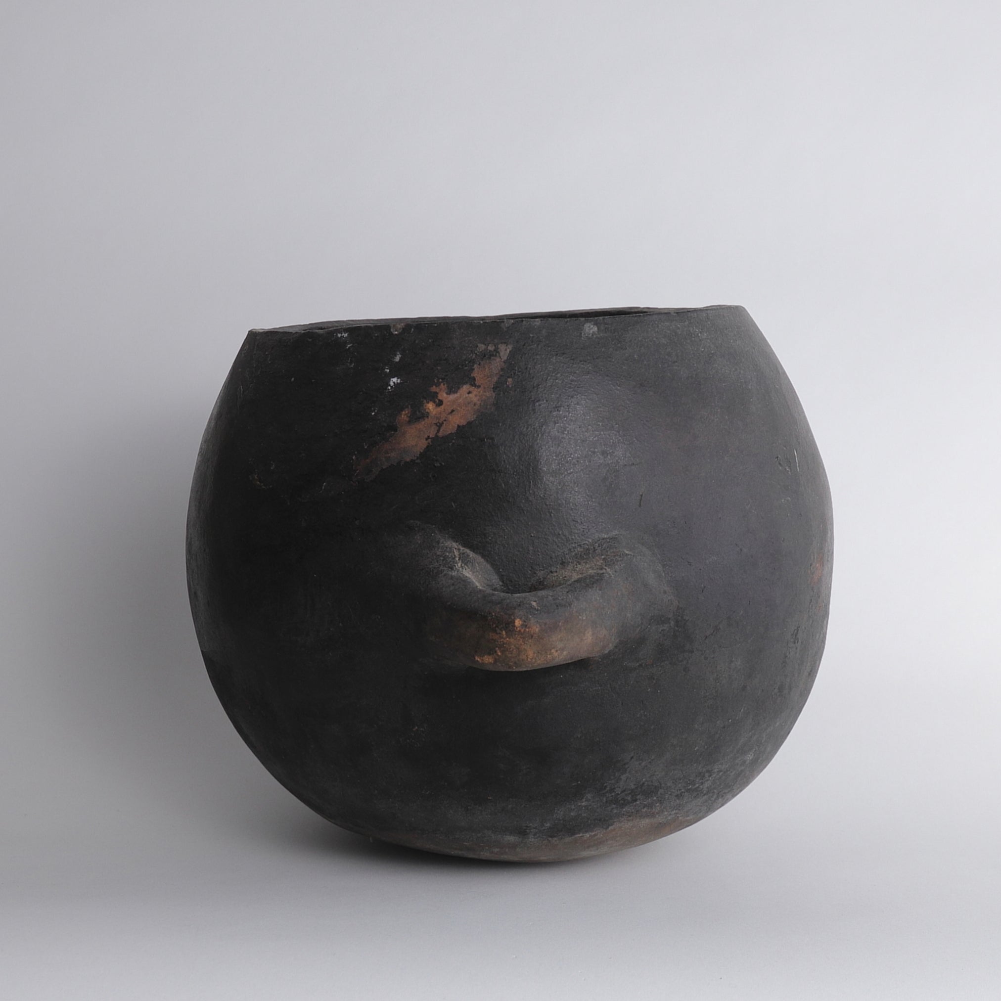 Black earthenware with large handle