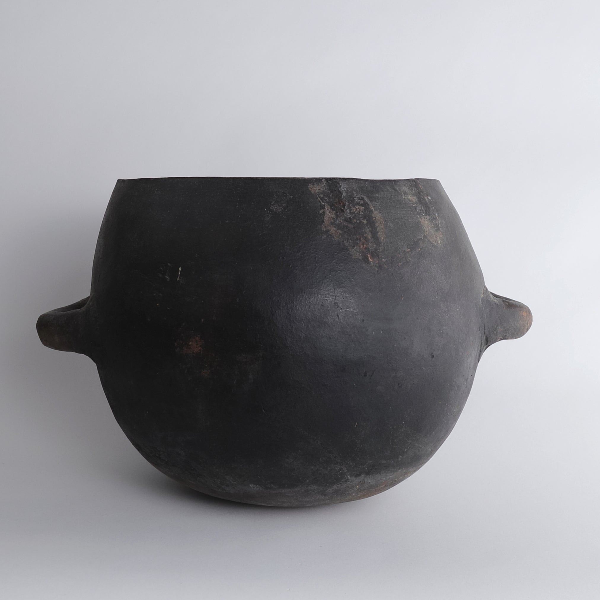 Black earthenware with large handle