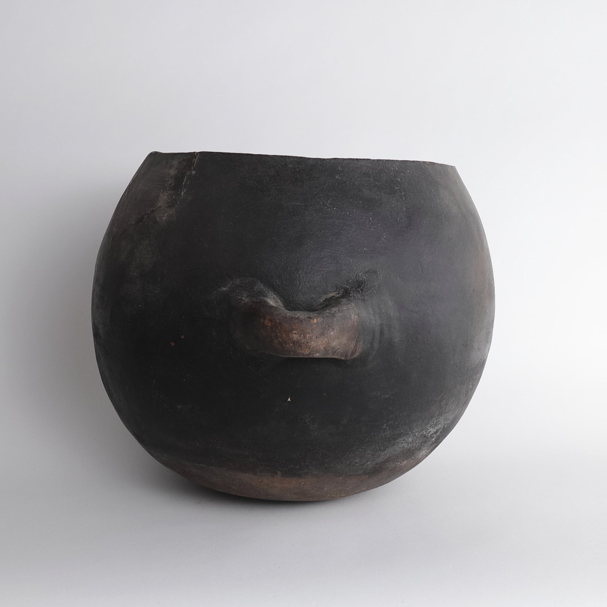 Black earthenware with large handle