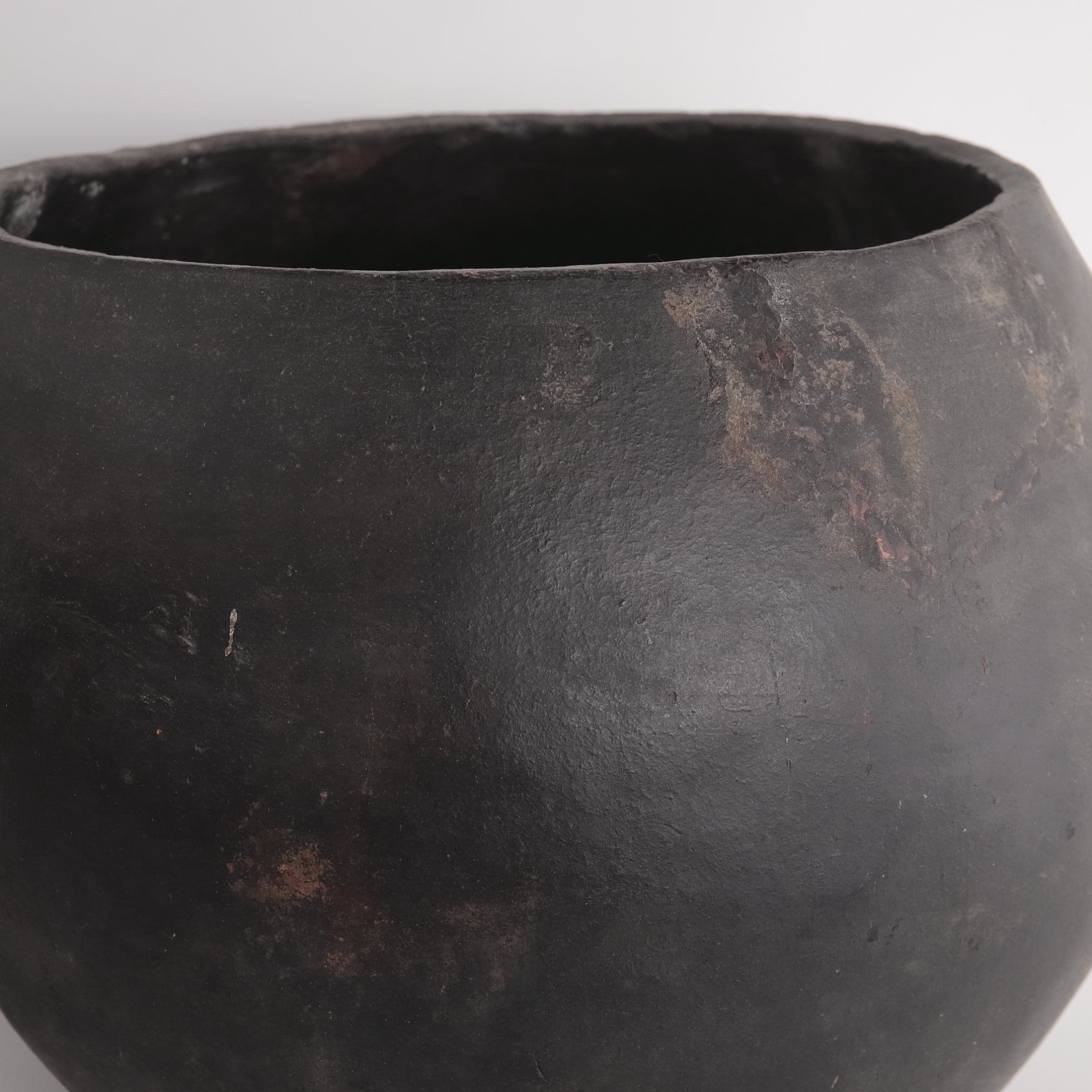 Black earthenware with large handle