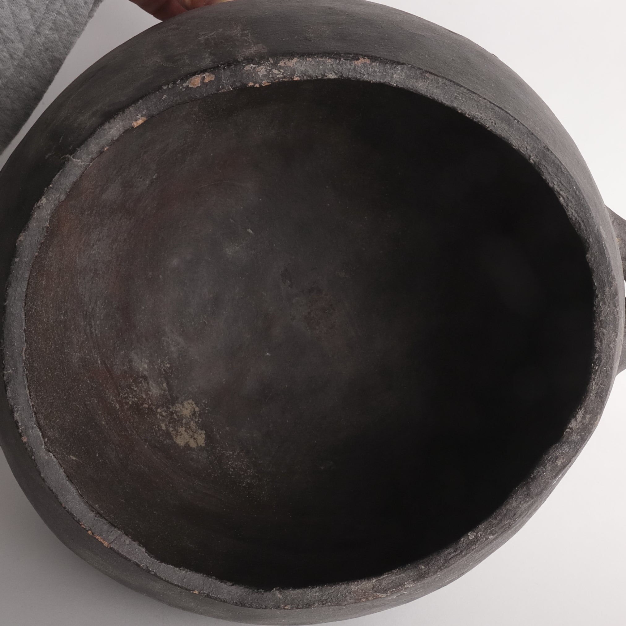 Black earthenware with large handle