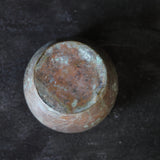 Old bronze spilled water container