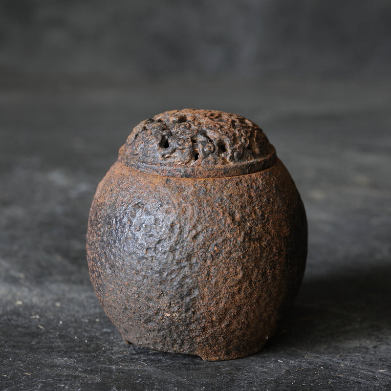 Rusted old iron incense burner