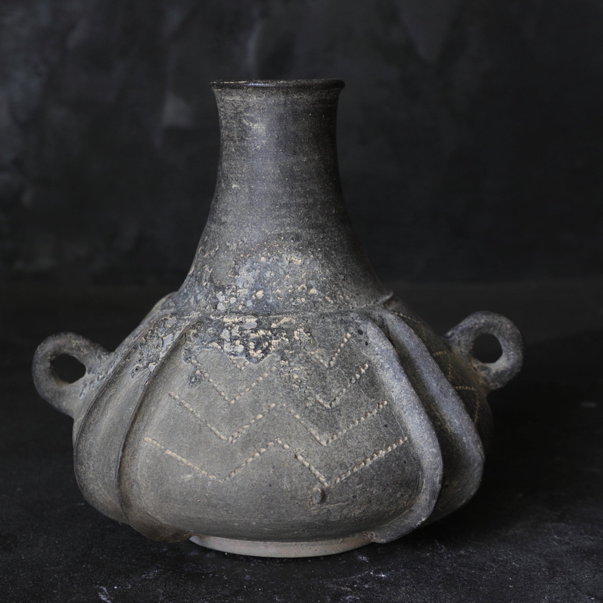 Sue ware Irregularly shaped jar with handle and engraving pattern Kofun/250-581CE