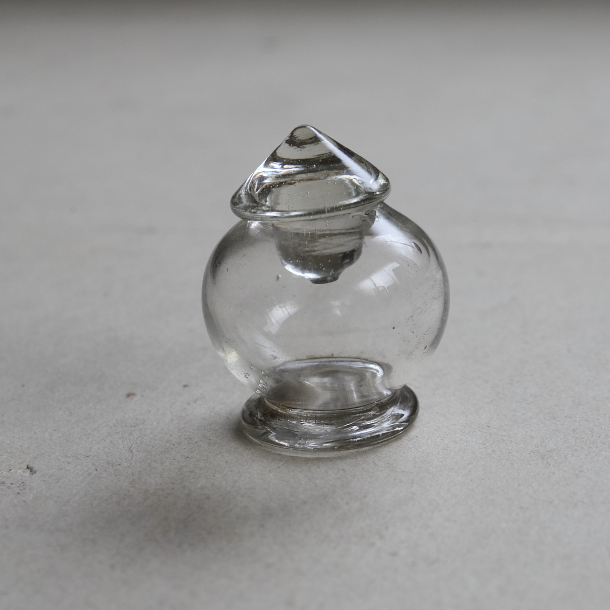 old glass tea container