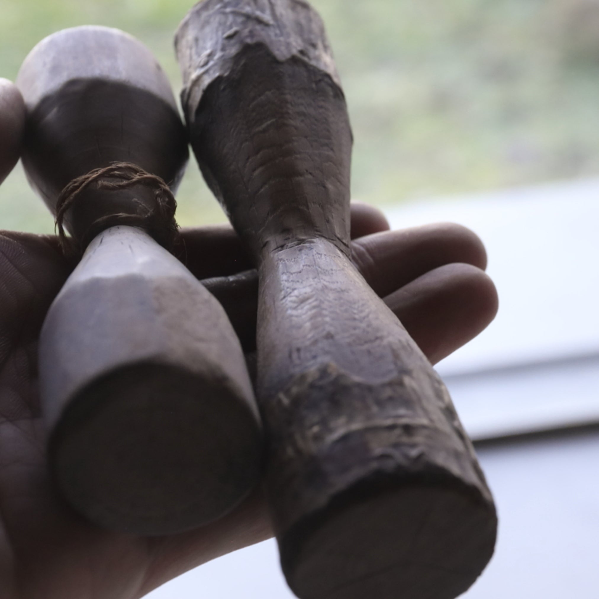 2 wooden weights