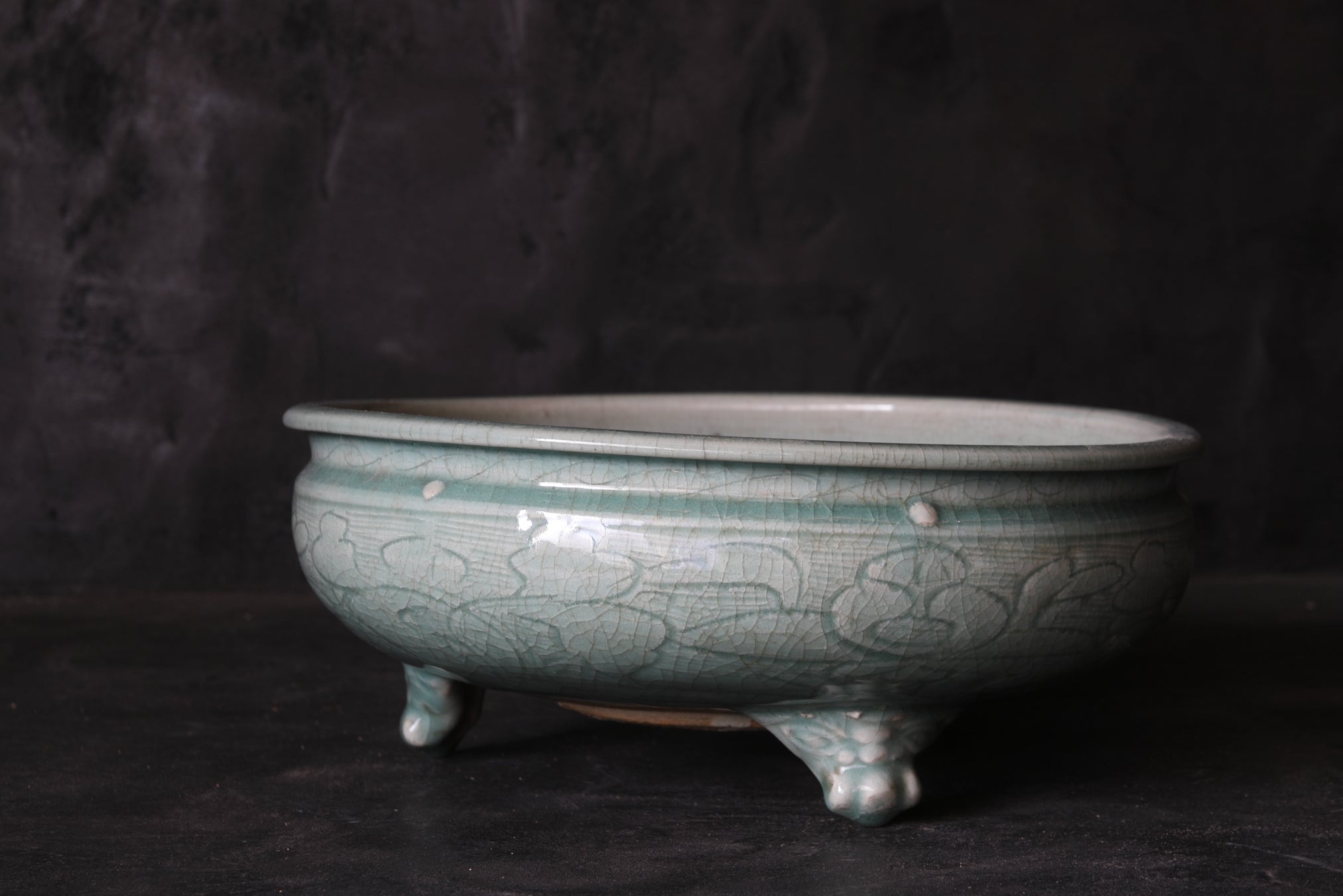 Celadon porcelain three-legged bowl with peony arabesque design Ming Dynasty/1368-1644CE