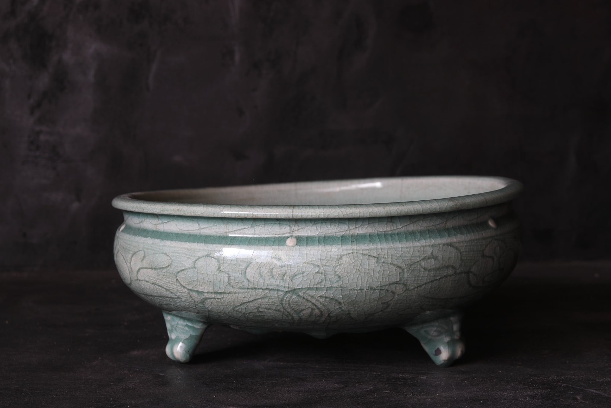 Celadon porcelain three-legged bowl with peony arabesque design Ming Dynasty/1368-1644CE